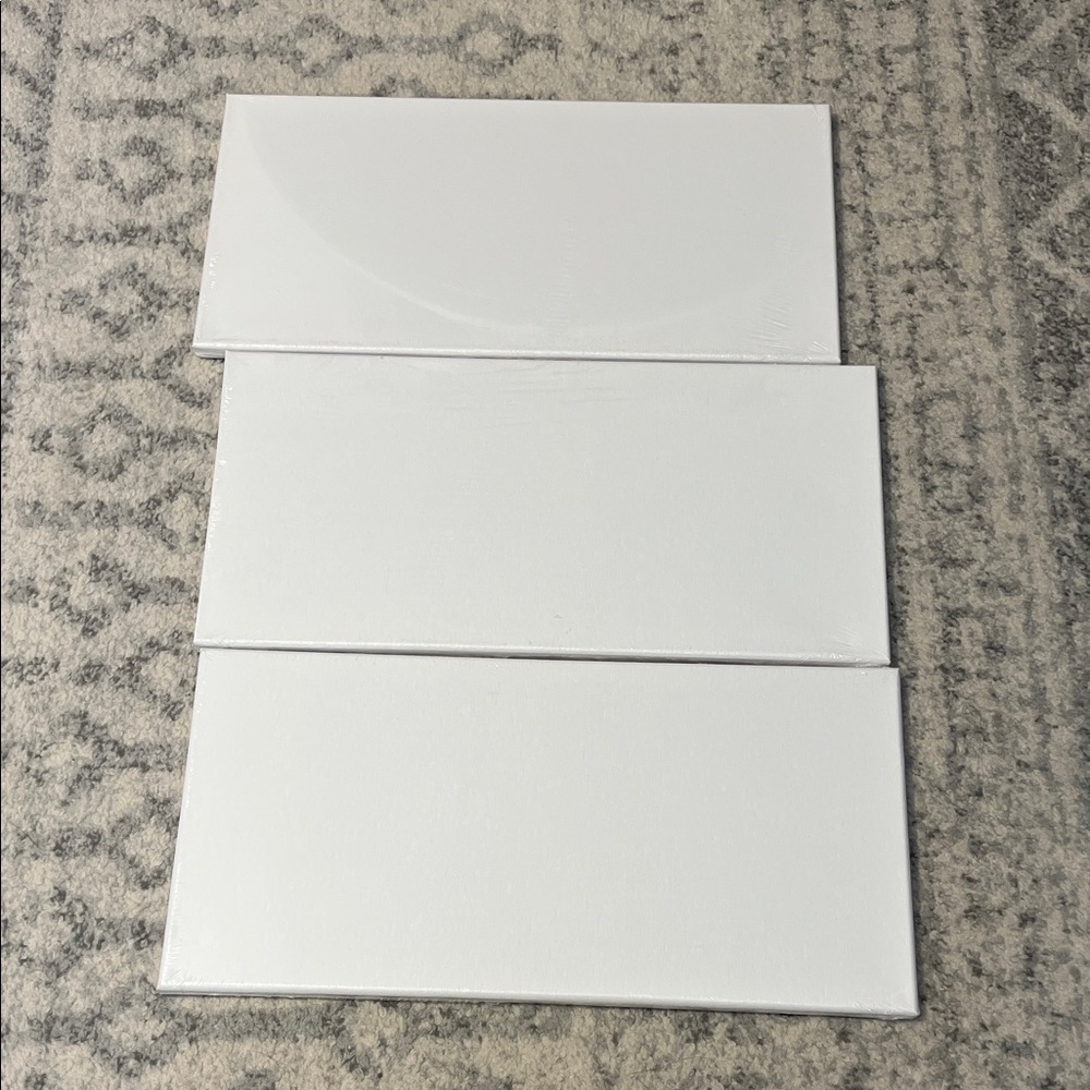 Set of Three White Canvas Panels